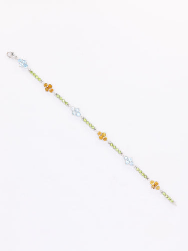 Bracelet Bracelet ligne en or blanc 18 carats avec citrines, péridots et topazes bleues 58 Facettes 1CA0000006/1