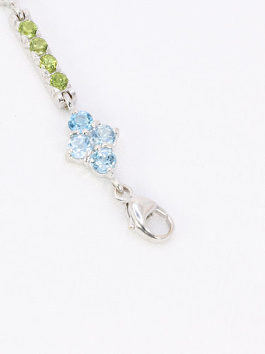 Bracelet Bracelet ligne en or blanc 18 carats avec citrines, péridots et topazes bleues 58 Facettes 1CA0000006/1