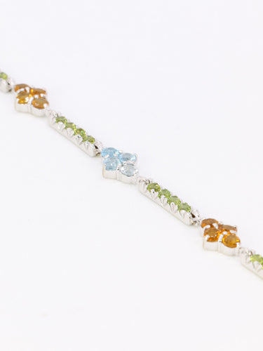 Bracelet Bracelet ligne en or blanc 18 carats avec citrines, péridots et topazes bleues 58 Facettes 1CA0000006/1