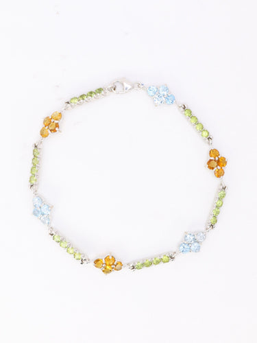 Bracelet Bracelet ligne en or blanc 18 carats avec citrines, péridots et topazes bleues 58 Facettes 1CA0000006/1