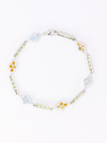 Bracelet Bracelet ligne en or blanc 18 carats avec citrines, péridots et topazes bleues 58 Facettes 1CA0000006/1