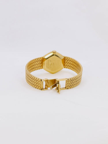 Montre Baume & Mercier - Montre vintage en or jaune 18 carats à maille tressée 58 Facettes 1067.3