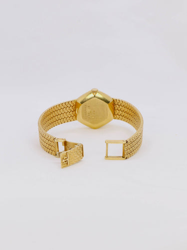 Montre Baume & Mercier - Montre vintage en or jaune 18 carats à maille tressée 58 Facettes 1067.3
