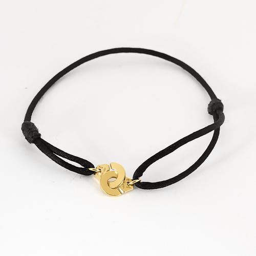 Bracelet DINH VAN - Serrure - Bracelet Menotte R8 en or jaune. Cordon noir. 58 Facettes DDV21270-1