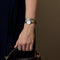 Montre BAUME & MERCIER - Petite Promesse - Montre en acier à boitier rond, mouvements quartz et diamants 58 Facettes DV26161-7