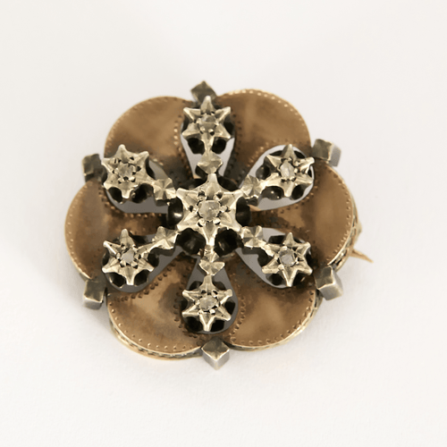Broche en or rose et or gris à motif de fleur ponctuée d'étoile et diamants de taille rose 58 Facettes DV0013-35