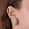 Paire de larges anneaux d'oreilles en or gris et diamants 58 Facettes DV27418-1