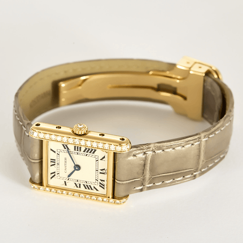 Montre Cartier Montre Tank en or jaune et diamants 58 Facettes DV31731-1