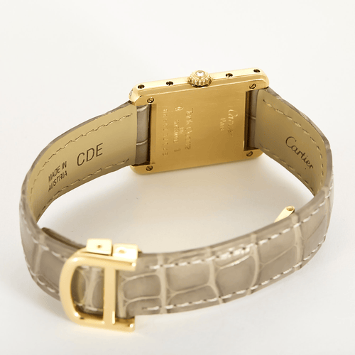 Cartier Montre Tank en or jaune et diamants