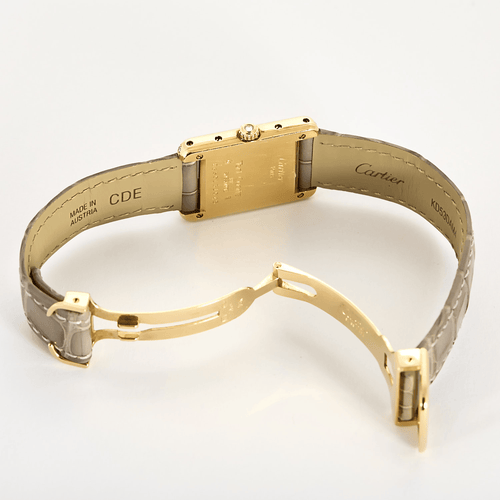 Montre Cartier Montre Tank en or jaune et diamants 58 Facettes DV31731-1
