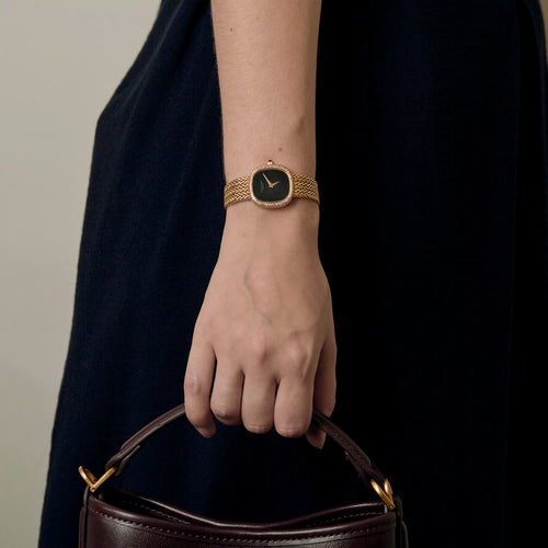 Patek Philippe Montre Ellipse Ladie's en or jaune et cadran onyx 58 Facettes DV31835-1