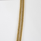 Collier en or jaune à maille gourmette et pendentif filigrané à motif de fleur 58 Facettes DV32806-5