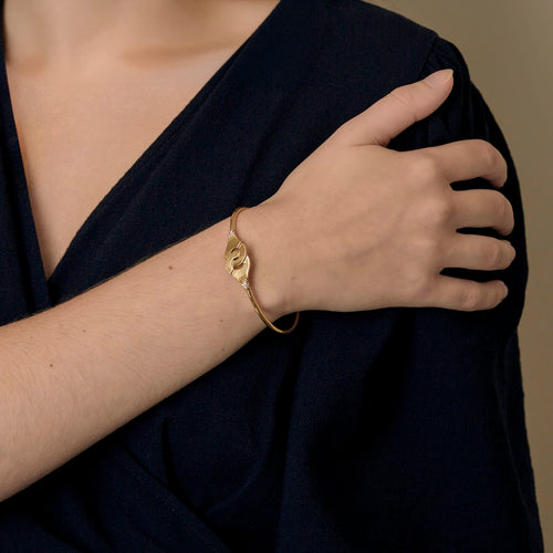DINH VAN - Menottes R12 - Élégant bracelet en or jaune et diamants 58 Facettes DV33748-1
