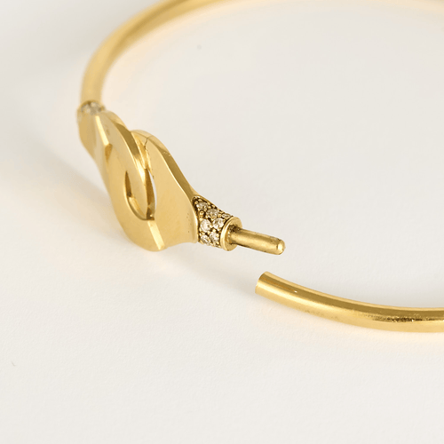 DINH VAN - Menottes R12 - Élégant bracelet en or jaune et diamants 58 Facettes DV33748-1