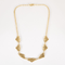 Élégant collier draperie en or jaune