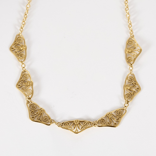 Élégant collier draperie en or jaune