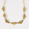 Élégant collier draperie en or jaune