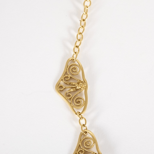 Élégant collier draperie en or jaune