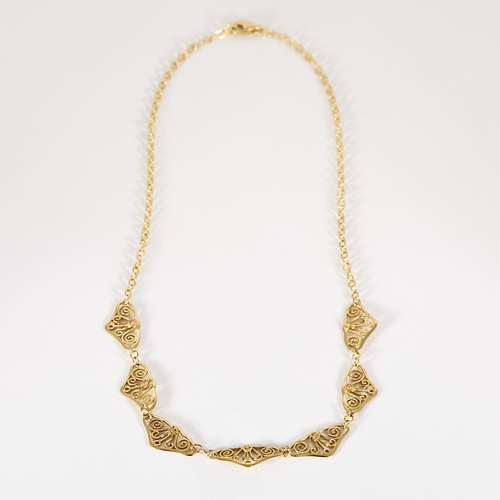Élégant collier draperie en or jaune
