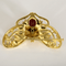 Broche chimère en or jaune et rubis étoilé : 2 carats 58 Facettes DV34335-1