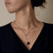 Chanel - Camélia - Collier en or blanc, diamants : 0,20 carat et onyx 58 Facettes DV33076-6