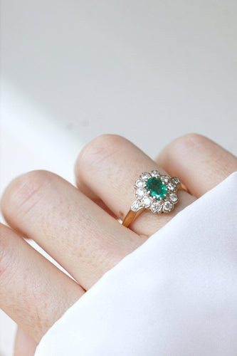Bague 65 Bague marguerite en or jaune et blanc 18k, émeraude et diamants 58 Facettes