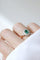 Bague 65 Bague marguerite en or jaune et blanc 18k, émeraude et diamants 58 Facettes