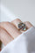 Bague 55 Bague volutes en or jaune 18k et diamants, opales 58 Facettes