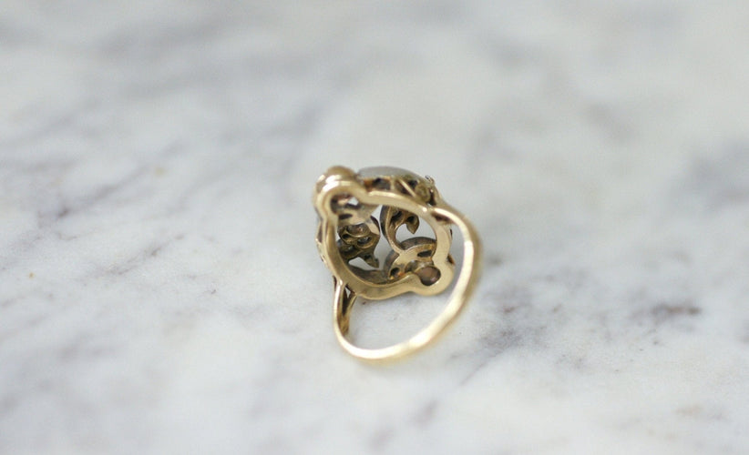 Bague 55 Bague volutes en or jaune 18k et diamants, opales 58 Facettes