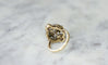 Bague 55 Bague volutes en or jaune 18k et diamants, opales 58 Facettes