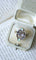 Bague 55 Bague volutes en or jaune 18k et diamants, opales 58 Facettes