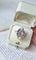 Bague 55 Bague volutes en or jaune 18k et diamants, opales 58 Facettes