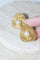 Boucles d'oreilles Gübelin - Boucles d’oreilles clip torsadées en or jaune 18kt et perles 58 Facettes