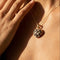 Pendentif Pendentif cœur en or jaune 14 carats avec diamants blancs et noirs 58 Facettes