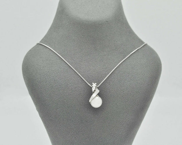 Collier Collier - Pendentif en or blanc 18 ct avec perle et diamants 58 Facettes 10852