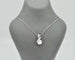 Collier Collier - Pendentif en or blanc 18 ct avec perle et diamants 58 Facettes 10852