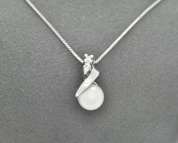 Collier Collier - Pendentif en or blanc 18 ct avec perle et diamants 58 Facettes 10852
