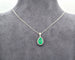Collier Collier - Pendentif en or blanc 18 ct avec émeraude colombienne et diamants 58 Facettes 8895