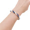 Bracelet Bracelet articulé en or blanc 750 serti de diamants et saphirs 58 Facettes 33891