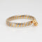 Bracelet Bulgari Tubogas - Bracelet vintage en or jaune 18k et acier 58 Facettes G13646