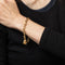Bracelet Tiffany & Co - Bracelet à breloques Cupid Arrow en or jaune 18k 58 Facettes G13931