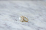Bague 50 Bague marguerite ancienne en or jaune 18kt, diamants et perle fine 58 Facettes