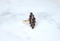 Bague 55 Bague marquise en or rose 18kt et grenats sur paillon 58 Facettes