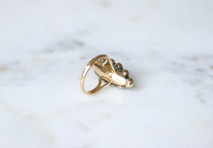 Bague 55 Bague marquise en or rose 18kt et grenats sur paillon 58 Facettes