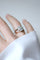 Bague 56 Bague marguerite Art Déco en or blanc et platine et diamants 58 Facettes