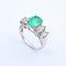 Bague 54 Bague en or blanc, émeraude et diamants 58 Facettes