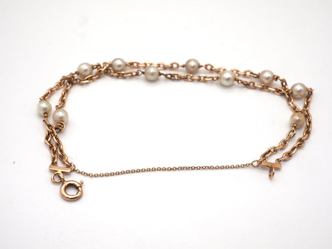 Bracelet Bracelet en or jaune et perles blanches 58 Facettes