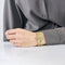 Bracelet Bracelet ruban, or jaune et turquoise 58 Facettes CAN1109