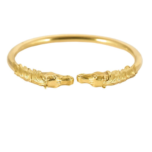 Bracelet Bracelet jonc ouvert en or jaune à motif de têtes de cheval 58 Facettes VES0548