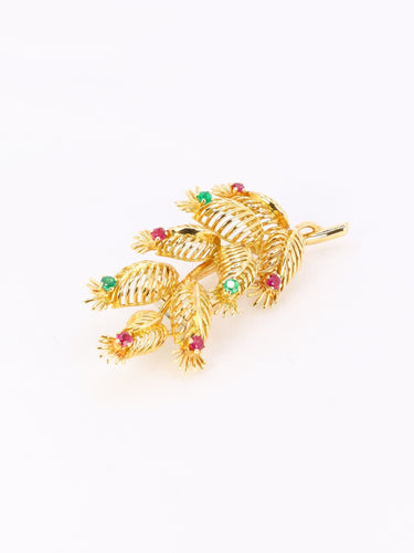 Broche GUBELIN Broche feuille or rubis émeraudes 58 Facettes 1126.1